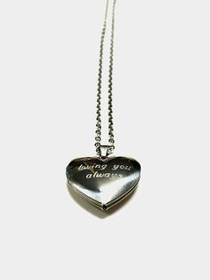 "The Stainless steel heart locket captures your love story in a polished and timeless way. Beautifully engraved with your unique message, it makes a heartfelt gift for your wedding day or special anniversary. With a stainless steel construction and lobster clasp closure, this locket will last forever. Pendant with chain length: 45cm/18\" + 5cm/2\". Weight:5g **No refunds for customized items unless the order was damaged in shipping or has an error. **We do not refund shipping charges or pay for Double Heart Stainless Steel Necklace For Anniversary, Stainless Steel Heart Necklace For Anniversary On Valentine's Day, Silver Double Heart Stainless Steel Necklace, Silver Stainless Steel Double Heart Necklace, Keepsake Heart Necklace With Stainless Steel Heart Charm, Engraved Heart Pendant Locket For Personalized Gift, Silver Heart Necklace With Engraving Option For Anniversary, Stainless Steel Heart Necklace With Heart Charm For Keepsake, Engraved Stainless Steel Jewelry For Valentine's Day