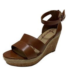 Walk tall and proud in this chic pair of Tarrah Wedge Sandals from American Rag. Manmade upperopen toe; 3-1/2-inch wedge heel; 1-inch platformBuckle at ankle strap; full back zipper closuremanmade soleImported Women Dress Shoes, Black Sandals Flat, Walking Tall, Gold Wedges, Brown Wedge Sandals, Platform Wedge Heels, Brown Wedges, Evening Sandals, Sandals Brown