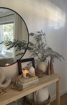 a mirror sitting on top of a wooden table