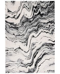 a black and white rug with wavy lines on it