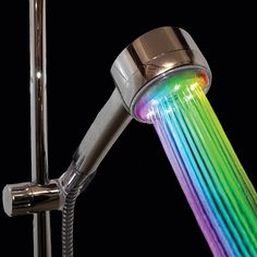 a faucet with rainbow colored water running from it's spigot