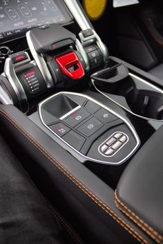 the interior of a car with buttons and controls