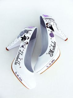 two white shoes that are sitting on top of each other with the words happily married written on them