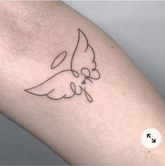 a tattoo on the arm of a woman with a dove and an i love you sign