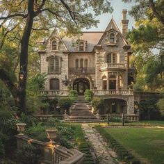 an old house with stone steps leading up to it