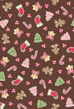 christmas cookies and candy canes on brown background