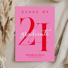 a pink graduation card with the number twenty one on it next to some dried flowers