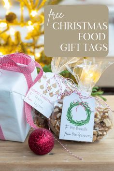 christmas food gift tags on a table next to a present bag and ornament