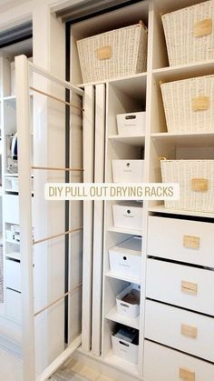 an organized closet with white drawers and baskets