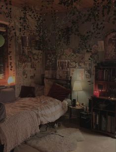 a bedroom with lots of plants hanging from the ceiling