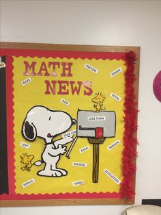 a bulletin board with the words math news written on it and a cartoon dog holding a mailbox