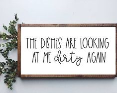 a sign that says the dishes are looking at me dirty again