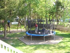 a person is jumping on a trampoline in the park