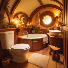 a bathroom with a toilet, sink and bathtub in the middle of wood flooring