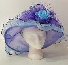 Big Kentucky Derby Hat, Sheer Iridescent, lavender blue sheer Derby hat with detachable Blue Rose with blended  lavender and purple ostrich feather hair clip... The hair piece alone is simply beautiful Blue Curved Brim Fascinator For The Beach, Blue Curved Brim Fascinator For Beach, Purple Mini Hat With Curved Brim For Beach, Purple Curved Brim Mini Hat For Beach, Blue Curved Brim Costume Hat For Church, Blue Brimmed Mini Hat For Races, Blue Cloche Hat For Spring, Purple Wide Brim Spring Costume Hat, Blue Wide Brim Hat For Races