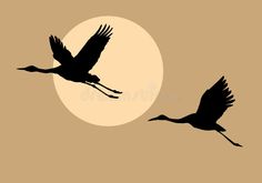 two storks flying in front of the sun at night with an orange background