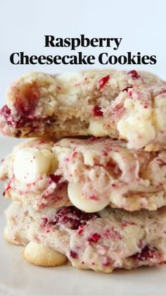 three cookies stacked on top of each other with white chocolate chips and cranberries