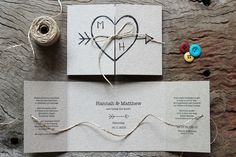 two wedding stationery cards with buttons and twine