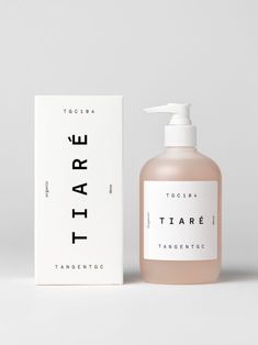 a bottle of hand soap next to a white box on a gray background with the word tater printed on it