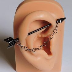 a fake ear with an arrow attached to it