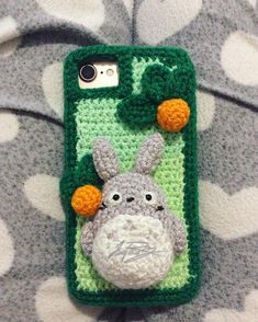 a crocheted phone case with an animal on it