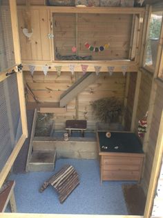 the inside of a wooden house with various items in it