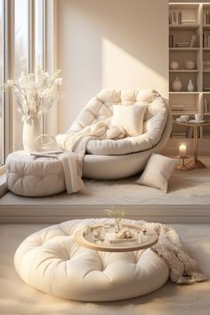 a living room filled with furniture and a large window next to a book shelf full of books