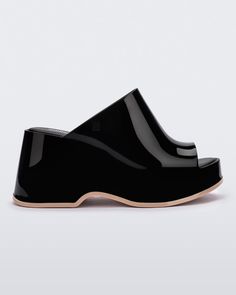 Throwback style meets current trends—that’s just how the Patty rolls. Lightweight and streamlined with a wide strap and a peep toe, these platform mules are true attention seekers, and the contrasting sole detail amps up the cool factor. Made from our revolutionary Melflex® PVC plastic, you enjoy more flexibility and c Modern Platform Slip-on Slides, Trendy Platform Slip-on Slides, Modern Black Clogs With Rubber Heel Cap, Modern Slip-on Slides, Summer Clogs With Translucent Outsole, Modern Open Toe Platform Slides, Modern Open Toe Platform Slippers, Black Platform Slide Mules, Modern Black Slide Mules