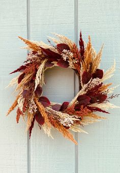 Fall wreath containing Biege, Brown, Burgundy, and Orange Pampas grass with Brown and Cream dried berries. There are also Burgundy leaves spread throughout. This wreath will add a unique touch to your Fall decor this year. The diameter of this wreath is 16-17 inches. Pampas Wreath, Acorn Wreath, Boho Wreath, Pom Pom Wreath, Faux Leaf, Fall Front Door, Hydrangea Wreath, Hanging Wreath, Autumn Wreath