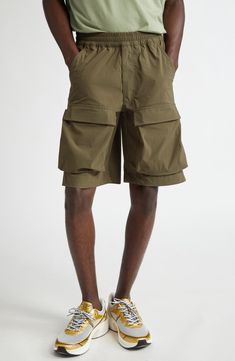 An ideal blend of function and fashion, these cargo shorts feature an elasticized waist, capacious pockets and a knee-grazing Bermuda silhouette. 10 1/2" inseam; 24" leg opening; 12" front rise; 17 1/2" back rise (size 50EU) Elastic waist Front scoop pockets; back button-welt pockets; cargo flap-patch pockets 85% polyamide, 15% elastane Hand wash, dry flat Made in Portugal Designer Clothing Utility Bermuda Bottoms With Built-in Shorts, Utility Bermuda Shorts With Built-in Shorts, Outdoor Cargo Bermuda Shorts, Outdoor Cargo Pocket Bermuda Shorts, Outdoor Relaxed Fit Cargo Pants With Built-in Shorts, Bermuda Shorts With Side Pockets For Outdoor Activities, Bermuda Shorts With Side Pockets For Outdoor, Functional Short Bottoms With Side Pockets, Functional Bottoms With Side Pockets And Short Legs