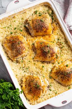 chicken with parmesan cheese in a casserole dish next to broccoli