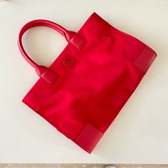 100% Authentic Guarantee 100% Nylon Ella Nylon Tote Closure Magnetic Snap 1 Zippered Pocket, 1 Slip Pocket New Without Tag Never Used Handle And Bottom Have Small Crease Mark. See The Photos Others Are Nice. Red Nylon Shopping Bag, Tory Burch Ella Tote, Ella Tote, Tory Burch Ella, Tory Burch Bags, Nylon Tote, Tory Burch Bag, Tory Burch, Bag Lady