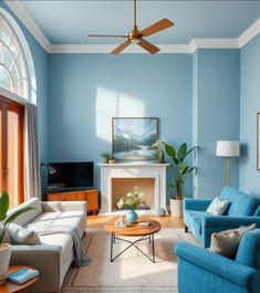 a living room filled with furniture and a fire place under a ceiling fan in front of a blue wall