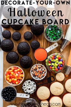 halloween cupcakes and other treats on a table with the words decorate your own halloween cupcake board