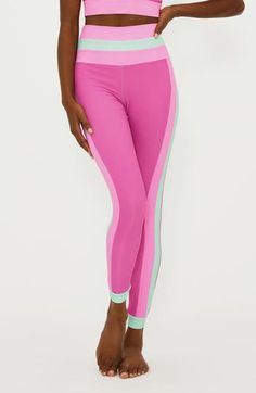 Sherbet-hued colorblock panels at the high waist and sides of these ultrasoft, ribbed second-skin leggings bring a sweet twist to a workout essential. Pull-on style 86% polyester, 14% spandex Machine wash, tumble dry Imported Sporty Color Block High Stretch Bottoms, Stretch Color Block Athleisure Bottoms, Stretch Color Block Bottoms For Athleisure, Compression Color Block Gym Bottoms, Sports Stretch Color Block Bottoms, Sporty Yoga Bottoms With Color Block, Fitted Color Block Gym Bottoms, Compression Color Block Workout Bottoms, Compression Color Block Sports Bottoms