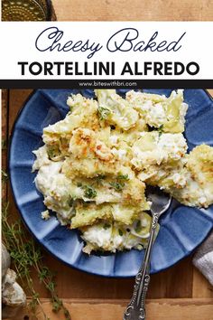 cheesy baked tortelli alfredo on a blue plate