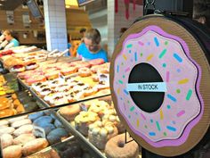 a doughnut shop with lots of donuts on display