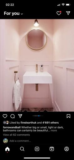 a bathroom with pink walls and a white sink in the corner, which is also on instagram