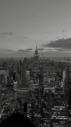 black and white photograph of city skyline at night