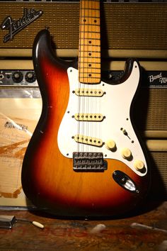 an electric guitar sitting on top of a table