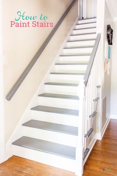 the stairs are painted white and have gray treads