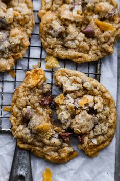 several cookies cooling on a rack with a spatula