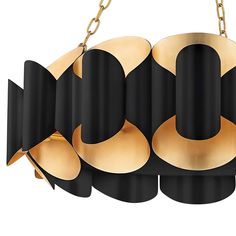 a black and gold chandelier hanging from a chain with four lights on it