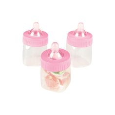 two pink baby bottles with lids filled with coins