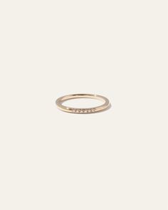 a gold ring with diamonds on it