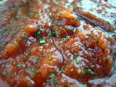 a close up view of some food with sauce and garnish on the top