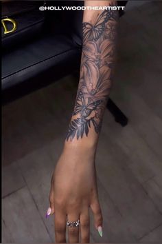 a woman's arm with tattoos on it