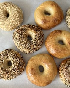 six bagels with sesame sprinkled on them