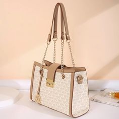 SPECIFICATIONSBrand Name: sunyhShape: SQUAREPlace Of Origin: GUANG DONG ProvinceHandbags Type: Shoulder BagsTypes of bags: Shoulder & Crossbody BagsOrigin: Mainland ChinaMain Material: PVCClosure Type: zipperHardness: HARDExterior: Solid BagStyle: ClassicLining Material: SilkOccasion: VersatileGender: WOMENPattern Type: LetterNumber of Handles/Straps: twoInterior: Interior Slot PocketInterior: Cell Phone PocketInterior: Interior Zipper PocketInterior: Interior CompartmentDecoration: LetterItem T Beige Square Bag With Adjustable Strap, Cream Rectangular Shoulder Bag For Daily Use, Luxury Beige Square Bags, Beige Top Handle Box Bag With Large Capacity, Beige Shoulder Box Bag, Cream Square Shoulder Bag, Cream Rectangular Baguette Bag For Travel, Cream Large Capacity Rectangular Baguette Bag, Large Capacity Cream Rectangular Baguette Bag