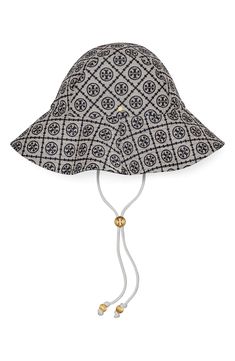 Jacquard featuring the distinctive Tory Burch monogram details a classic bucket hat accented with chic goldtone hardware. Drawcord-toggle chin strap Lined 57% cotton, 43% polyester Spot clean Imported | Tory Burch T Monogram Bucket Hat Designer Adjustable Hats For Travel, Designer Adjustable Bucket Hat With Curved Brim, Monogram Hat, Fancy Glasses, T Monogram, Monogram Hats, Monogram Prints, Blue Hat, New Wardrobe